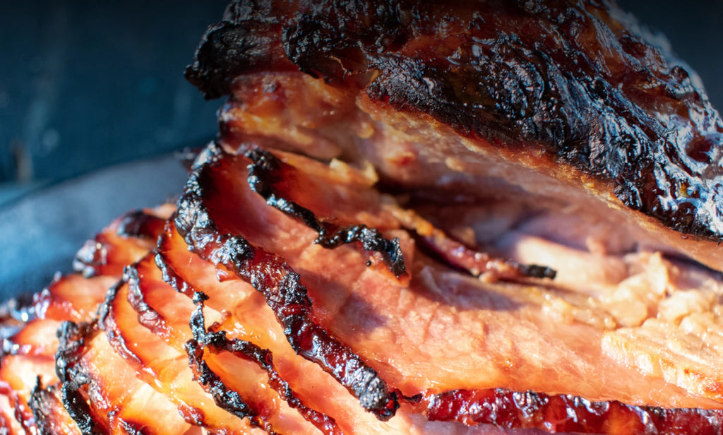 Extreme closeup of a ham, roasted with caramel brown crust