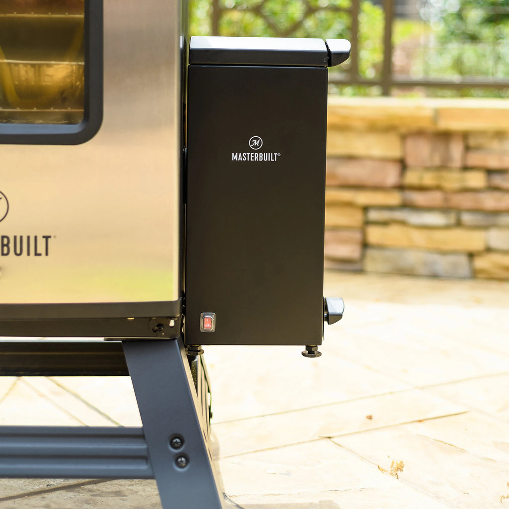 Close-up of the slow smoker accessory attached to electric smoker through the wood chip loader slot