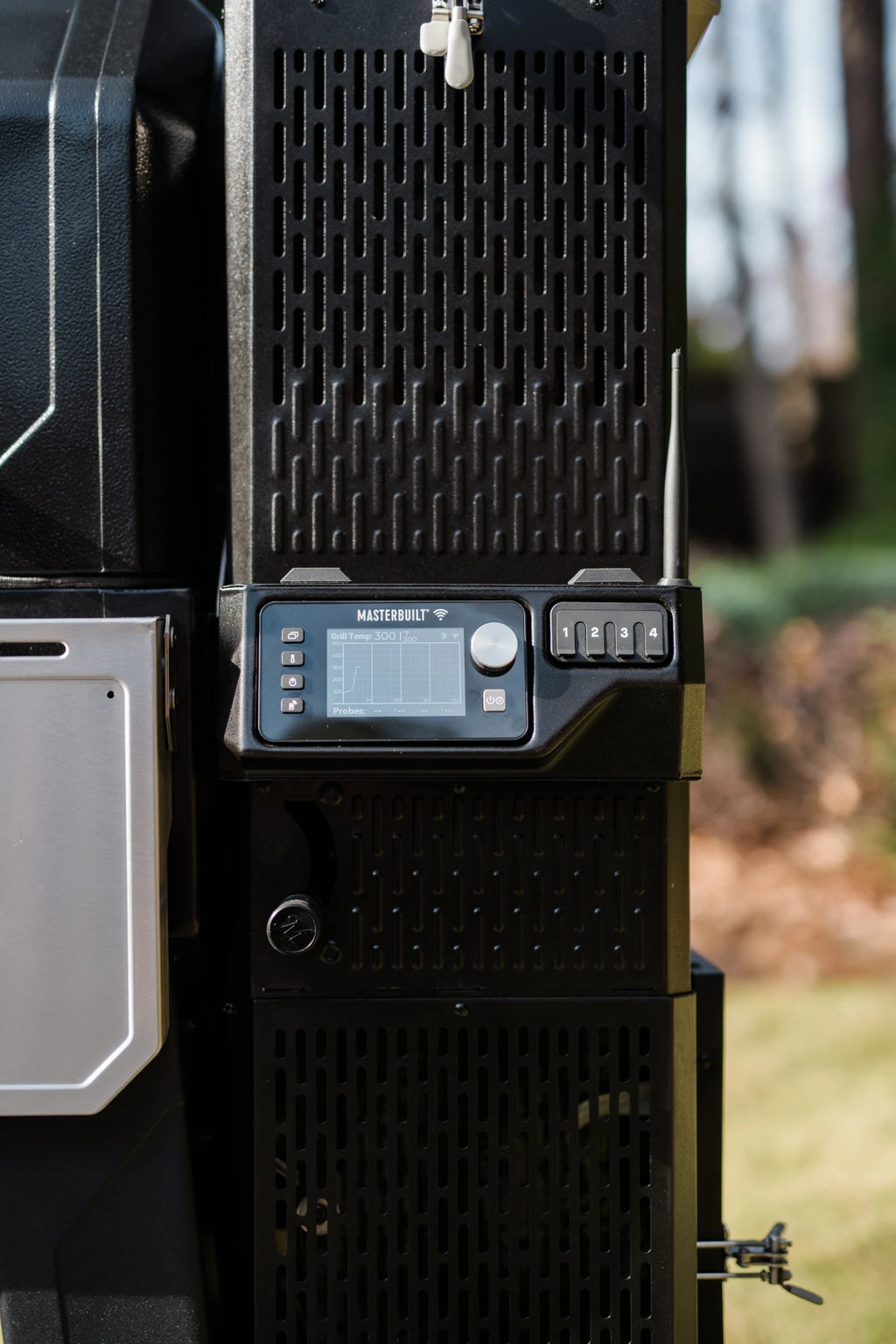 The control panel and charcoal hopper of a Gravity Series XT grill and smoker