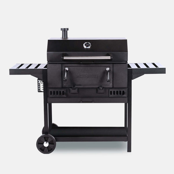 A 30 inch wide black charcoal grill mounted on a cart with 2 wheels and a metal shelf. The grill body has a chimney in the left rear, a temperature gauge in the top center of the lid, and a 2-handled access panel in the front of the grill base. 